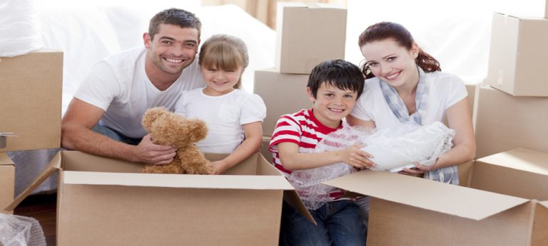 Family moving home with boxes around